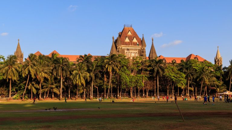 The Gothic stone facade and towers of the Bombay High Court building in Mumbai