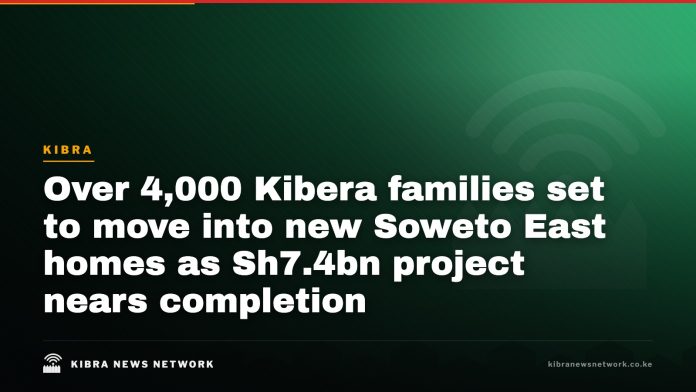 New apartment blocks rising above older Kibera housing.