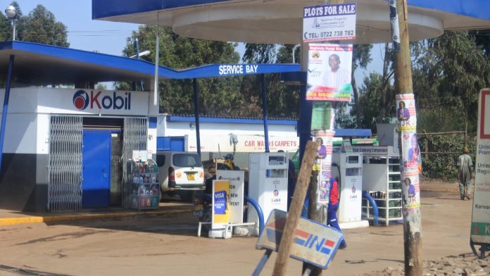 Cars at the pumps of a Kobil petrol station forecourt in Nairobi
