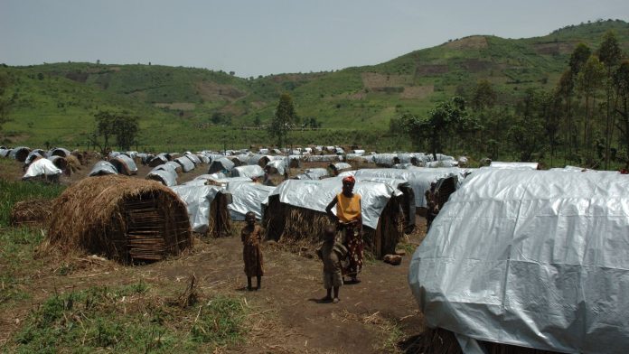 Rows of tarpaulin shelters at a displacement camp in eastern Democratic Republic of Congo