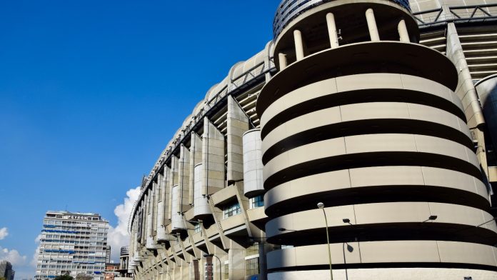 The curved concrete exterior of the Santiago Bernabeu stadium in Madrid
