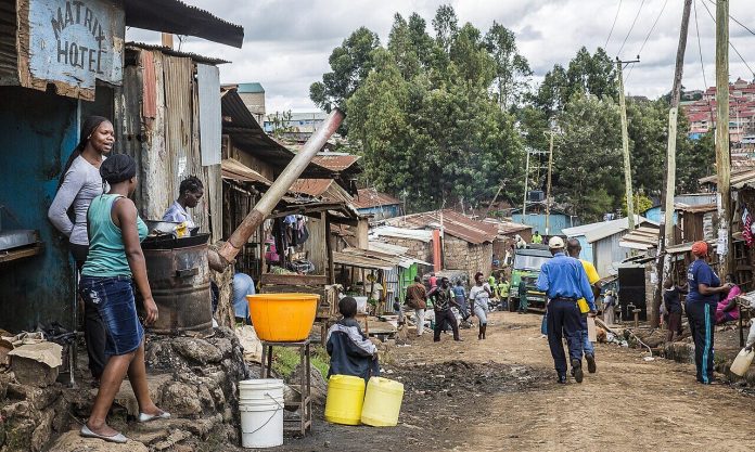 Garbage collection truck on a Kibera street