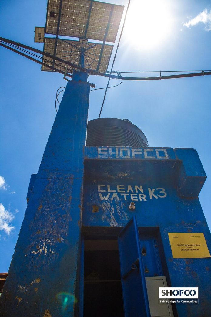 A Shofco water kiosk with solar panels in Kibera