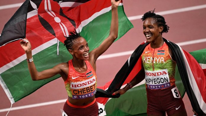 Beatrice Chebet and Faith Kipyegon celebrate with Kenyan flags at the 2025 World Championships in Tokyo