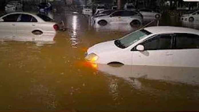 Cars submerged on a flooded Nairobi road