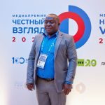 A participant at the press wall of the Honest View International Media Award ceremony in Moscow