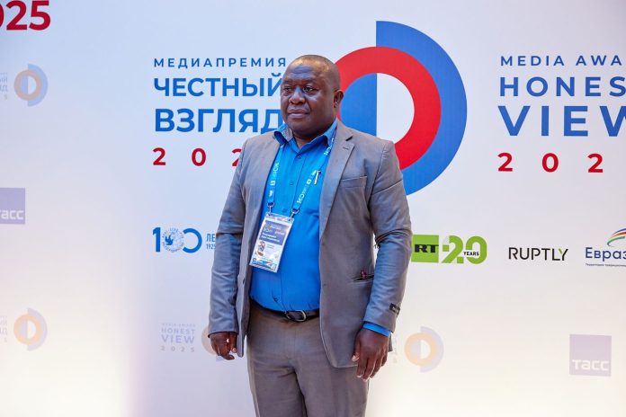 A participant at the press wall of the Honest View International Media Award ceremony in Moscow