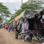 Clothes stalls along a path at Toi Market in Kibera, Nairobi, in 2015