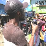 Hot Sun Foundation graduate filming in Kibera